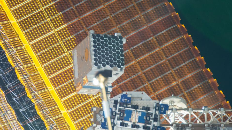 Scientific apparatus located against a solar panel.