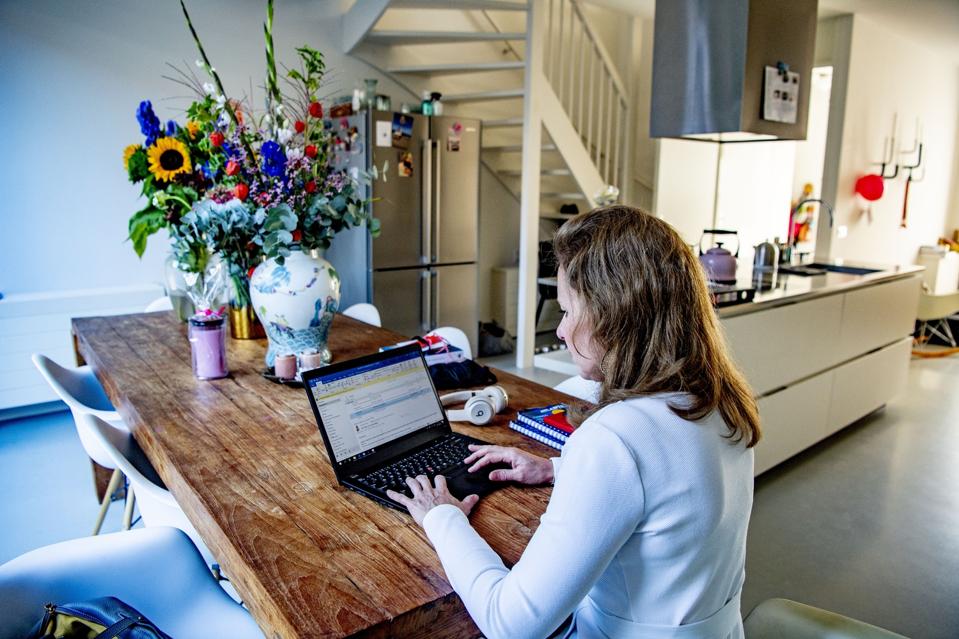 A woman working from home as a preventive measures against...