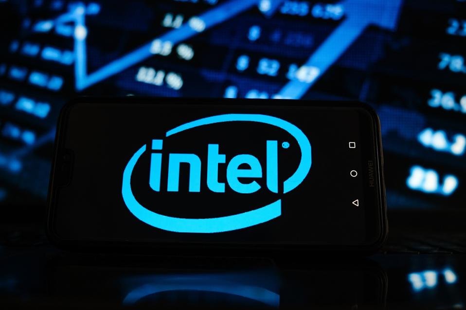 In this photo illustration an Intel logo seen displayed on a...