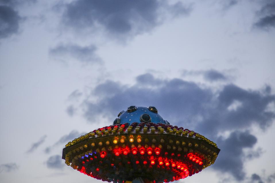 What appears to be a UFO is merely the top of a ride at an amusement park in Krakow.