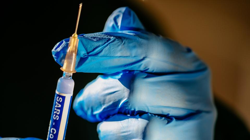 Syringe with vaccine against covid 19 ready to go.