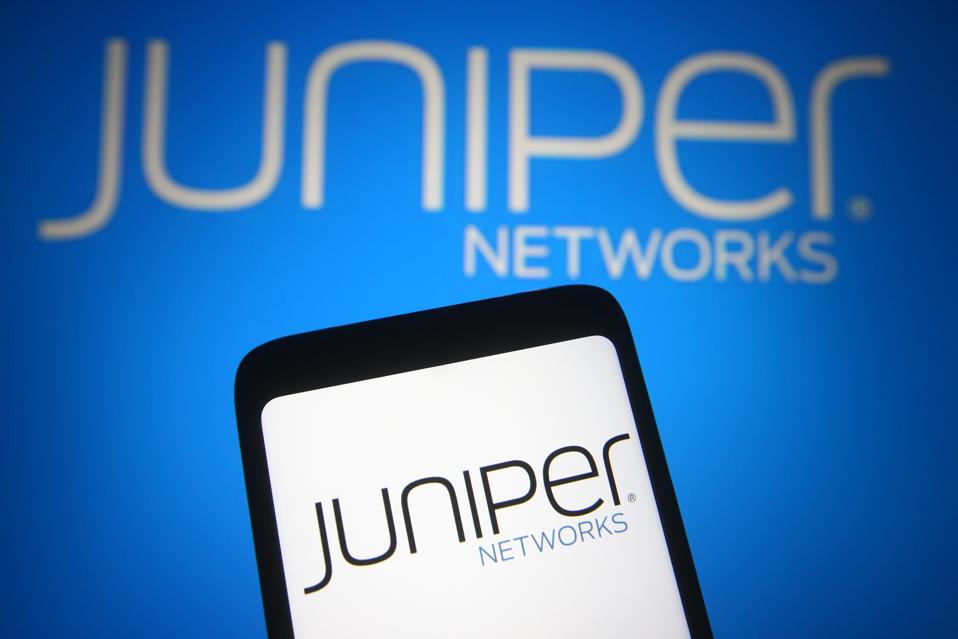 In this photo illustration a Juniper Networks logo is seen...