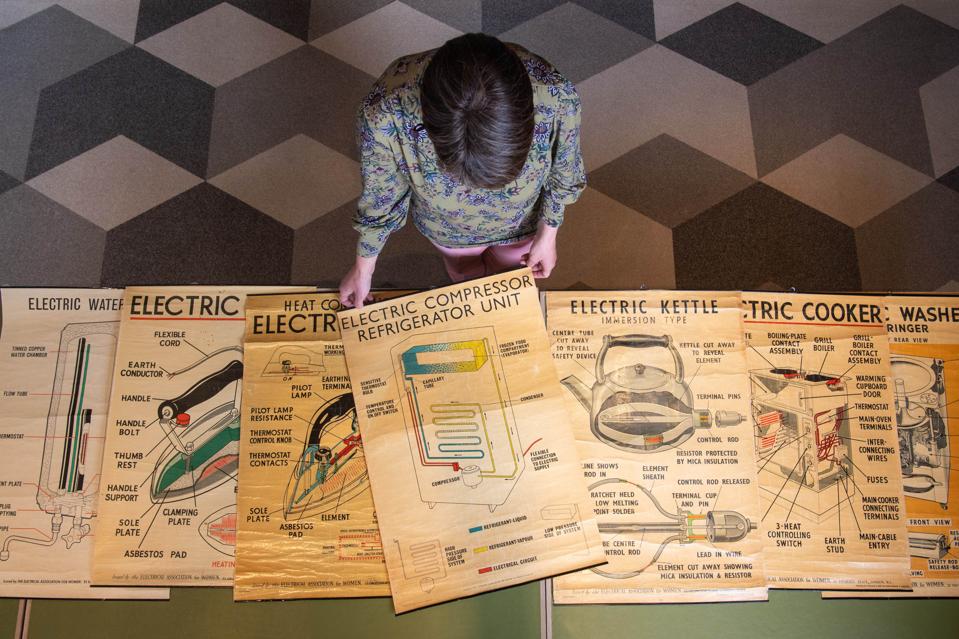 The IET Crowns The 15 Most Valuable Inventions Of The Last 150 Years Anne Locker, Library and Archives Manager at the Institution of Engineering and Technology, unveils a poster from the Electrical Association for Women, an organization that encouraged women to use electricity in the home