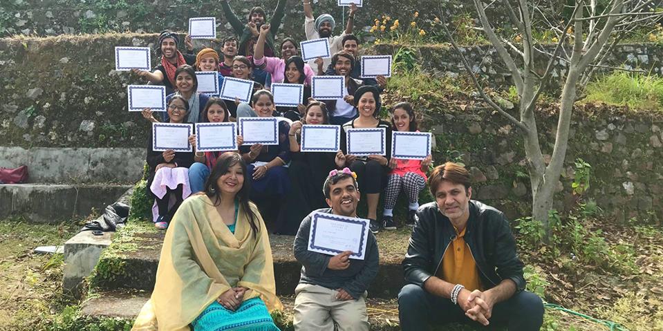 students holding certificates of achievement.
