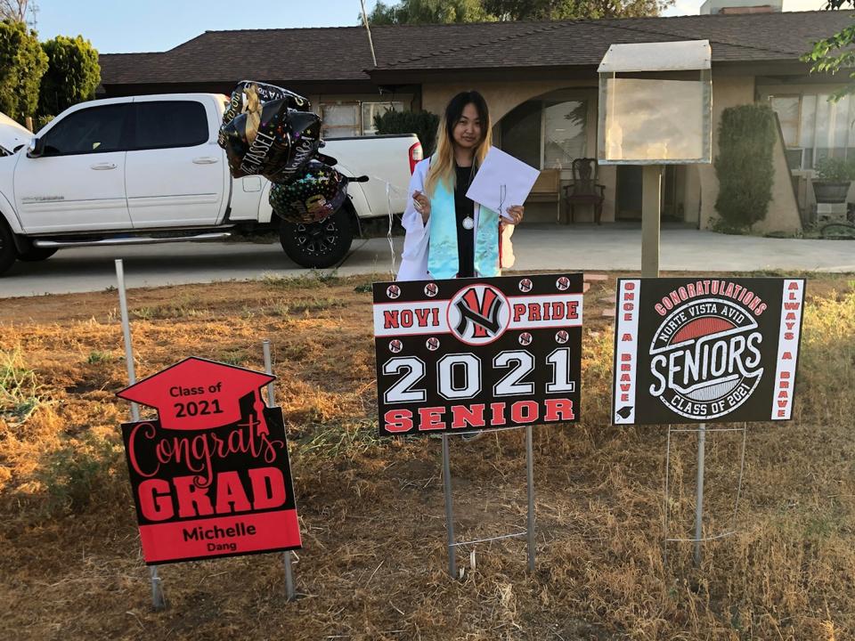 Michelle celebrating her high school graduation at home