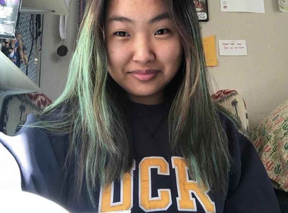 Michelle wearing a University of Riverside sweatshirt