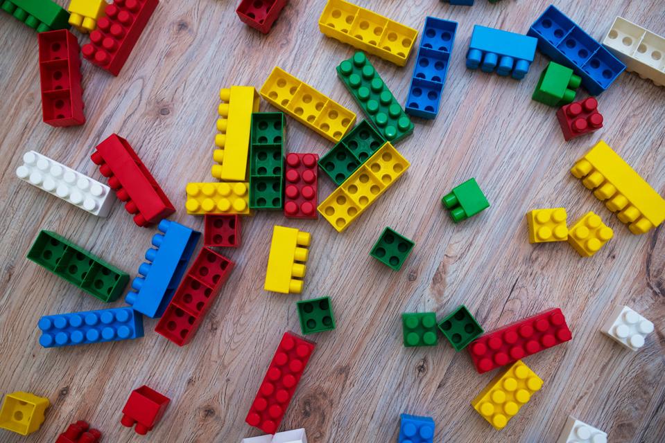 colored game cubes scattered on the floor