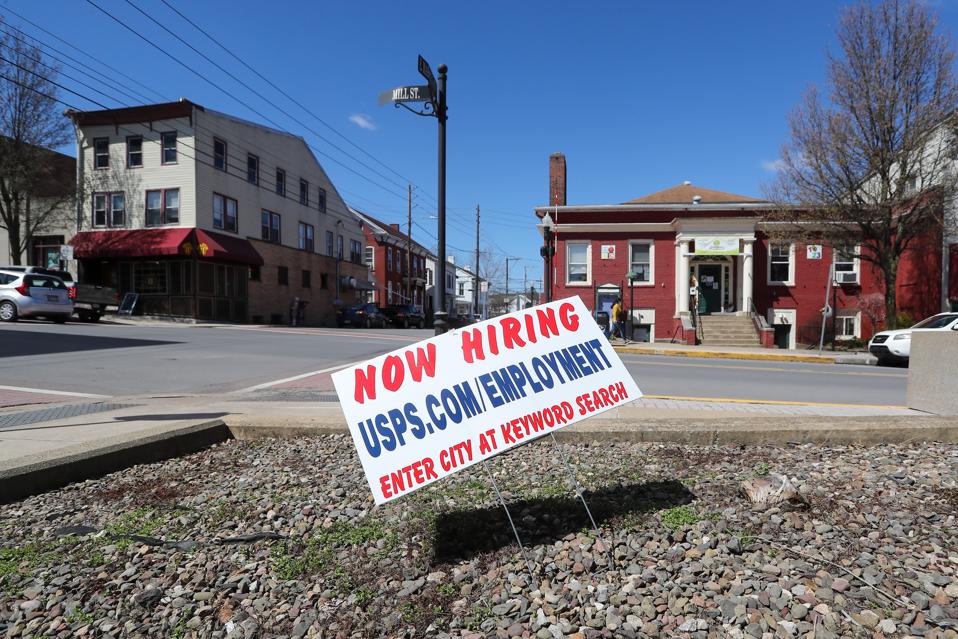 A now hiring sign at the Post Office in Danville...
