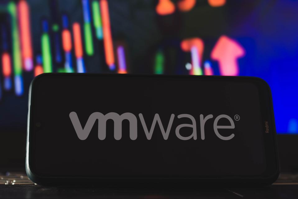In this photo illustration VMware logo seen displayed on a...
