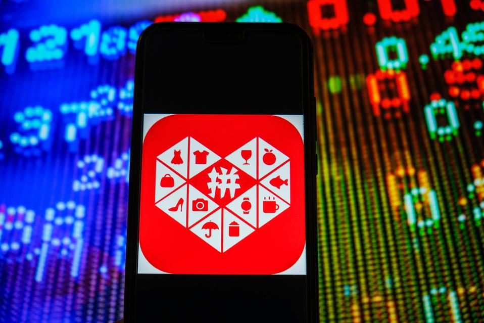 In this photo illustration, a Pinduoduo logo seen displayed...