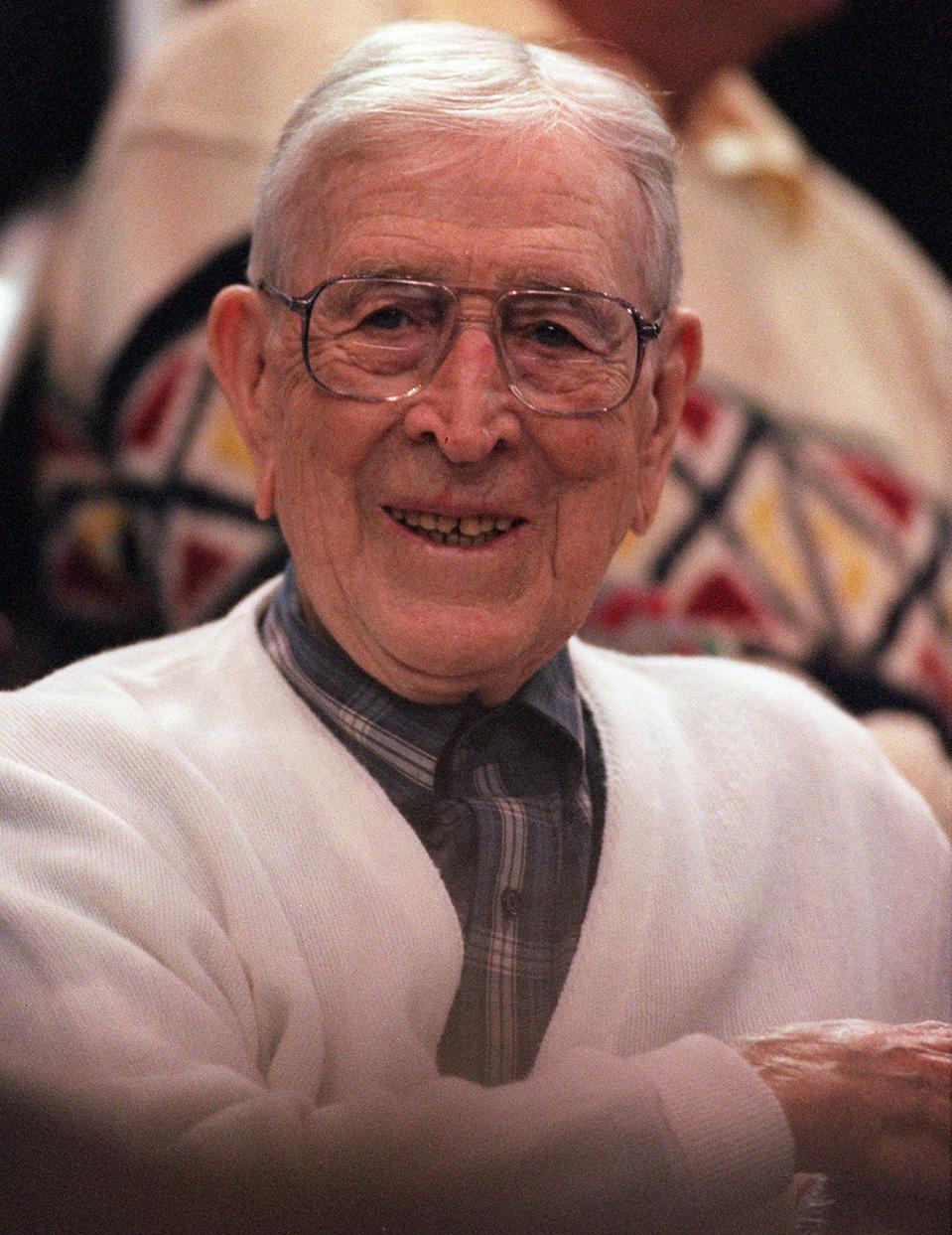 Legendary UCLA coach John Wooden takes in the action during a Bruin game at Pauley Pavilion on Dec.9