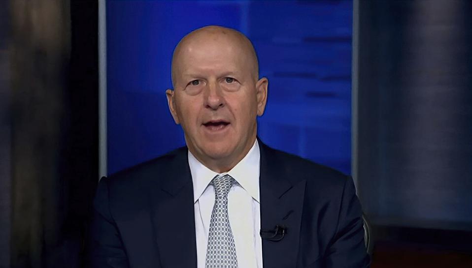 David Solomon in front of a blue screen