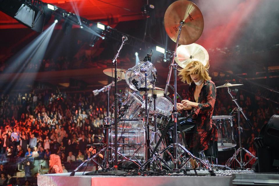 Yoshiki performs live on stage in Madison Square Garden.