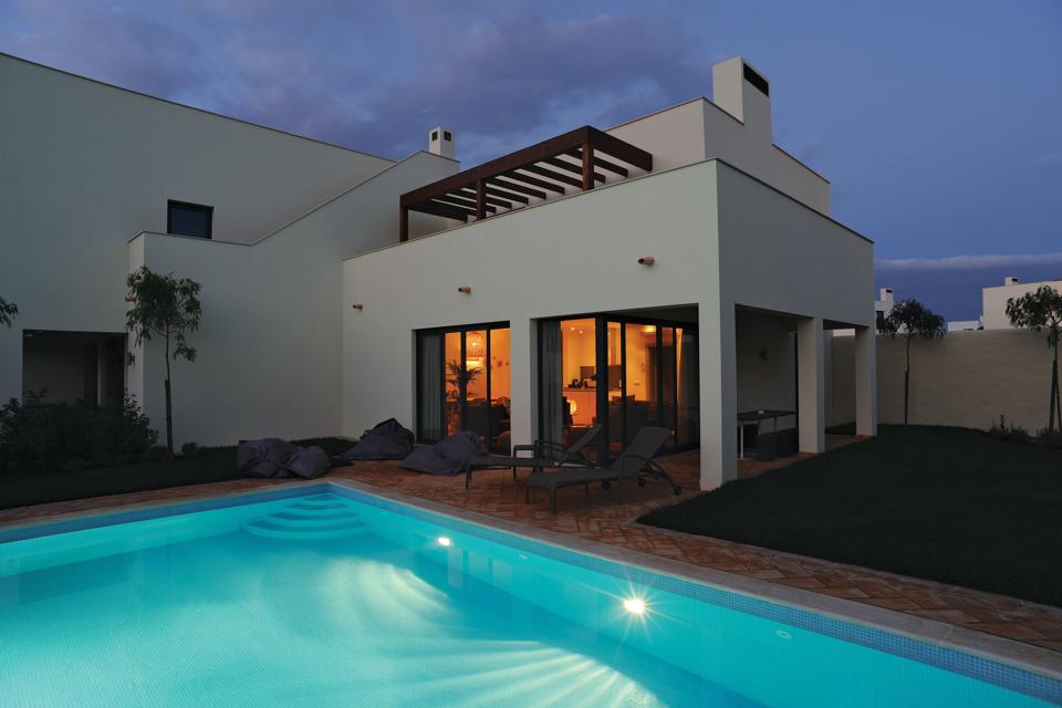 The pool at Pinewoods House at Martinhal Sagres resort in the Algarve, Portugal, is lit up