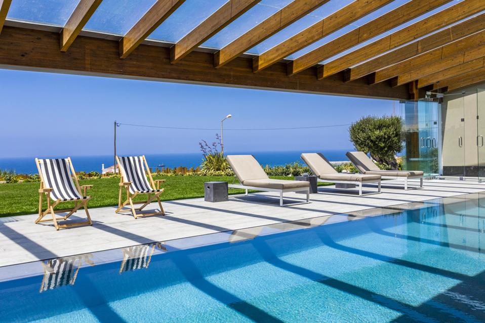 The pool at You and the Sea in Ericeira, Portugal, is bright and playful. 