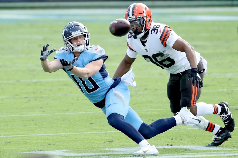 NASHVILLE, TENNESSEE - DECEMBER 06: Adam Humphries #10 of the Tennessee Titans catches a pass against M.J. Stewart Jr. #36 of the Cleveland Browns in the third quarter at Nissan Stadium on December 06, 2020 in Nashville, Tennessee. (Photo by Andy Lyons/Getty Images)