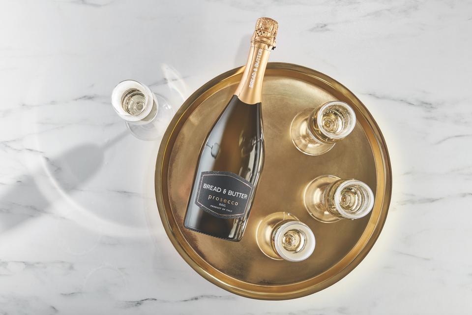 Bread & Butter Prosecco D.O.C. on brass platter with glasses