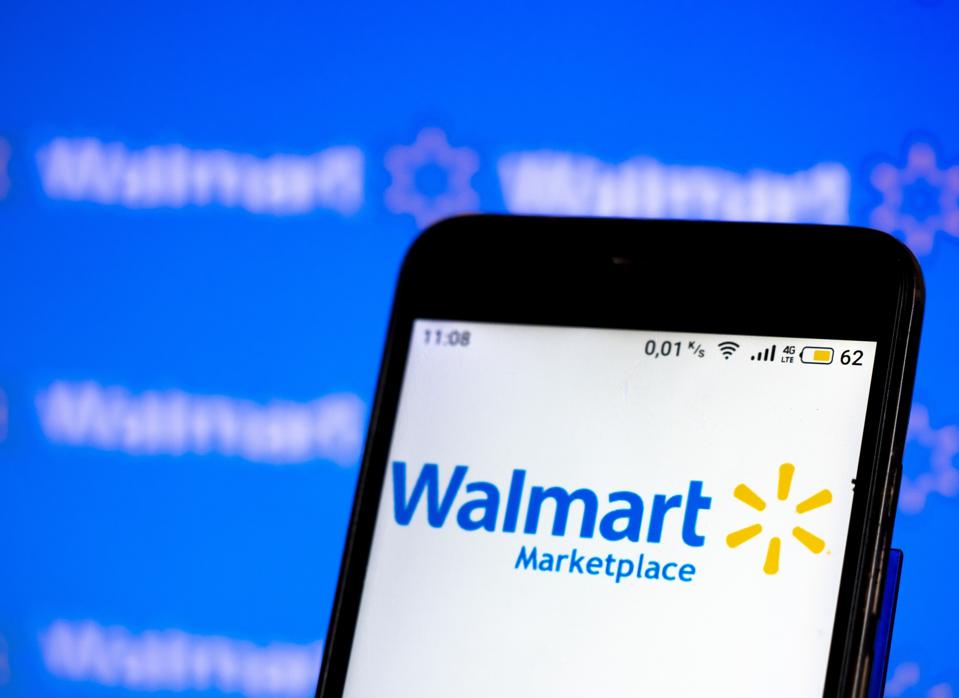 In this photo illustration a Walmart Market place logo seen...