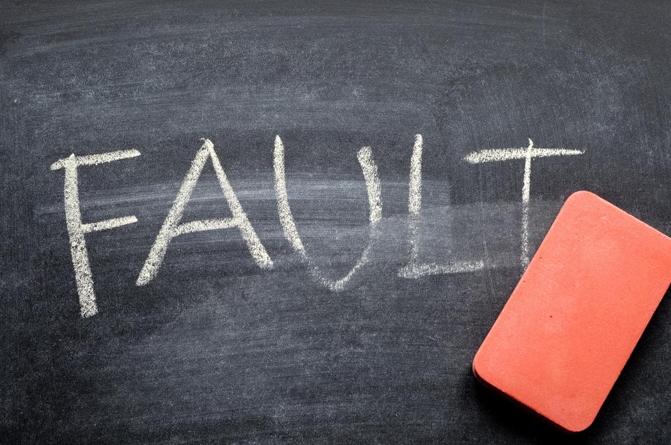 erasing fault, hand written word on blackboard being erased concept