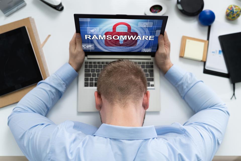 Sad Man With Laptop Infected By Malware
