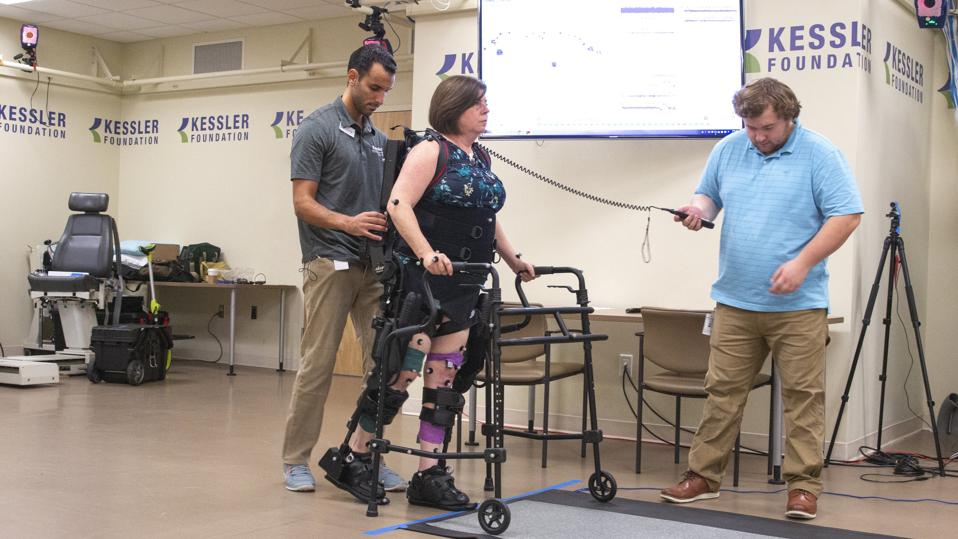 A research participant in the MS pilot study does exercise training in the Ekso NR at Kessler Foundation.