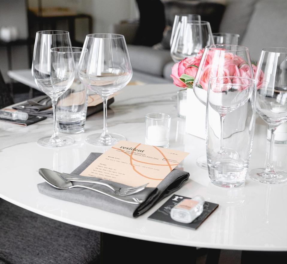 a bottle of hand sanitizer at the dining room table
