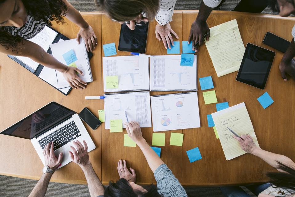 High angle view of business people planning in board room