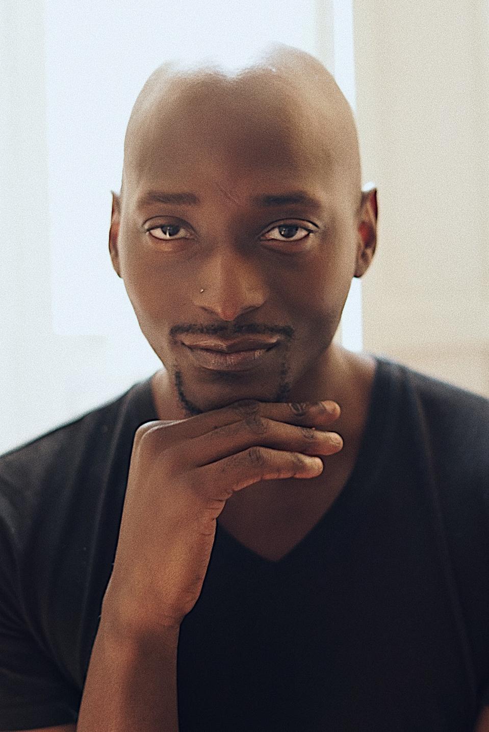Charles Afrika Quarles poses for a photo