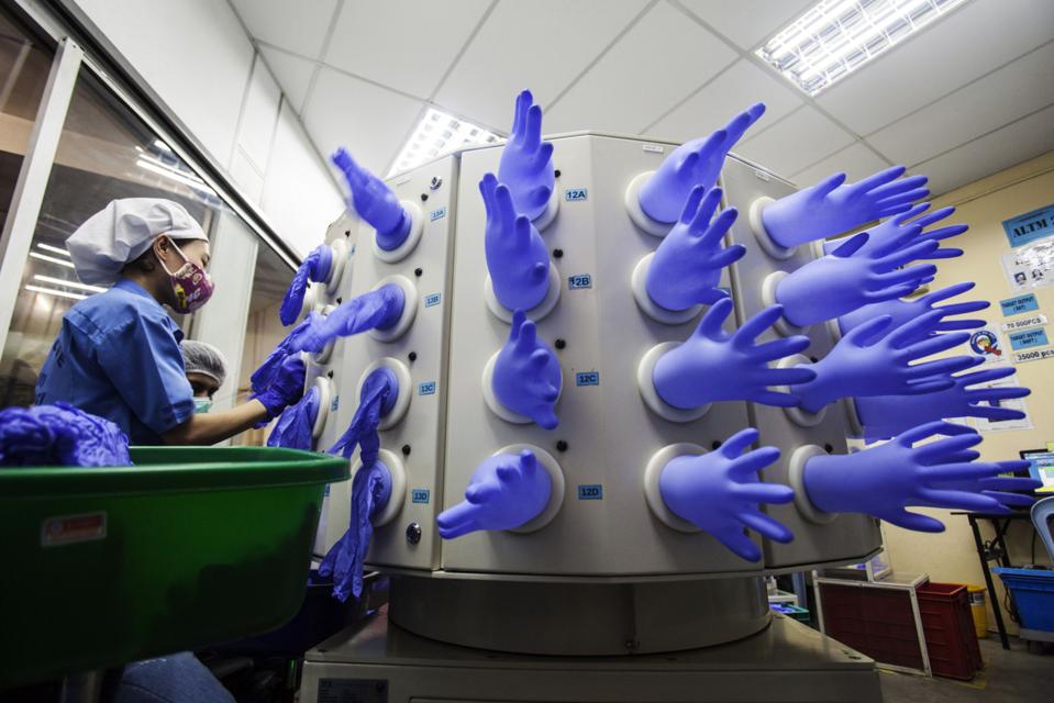 Production And Operations At Top Glove Corp. Headquarters And Portraits Of Chairman Lim Wee Chai