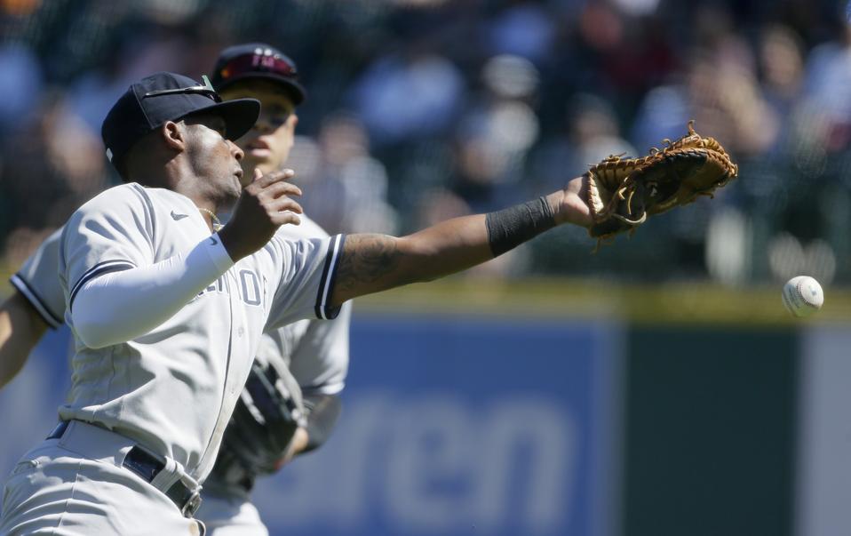 First baseman Miguel Andujar drops a foul ball with Aaron Judge running towards it.