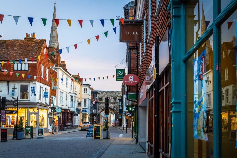 View of Salisbury High Street shops in the evening with bunting outside