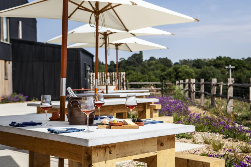 Outdoor table with arenas and wine.