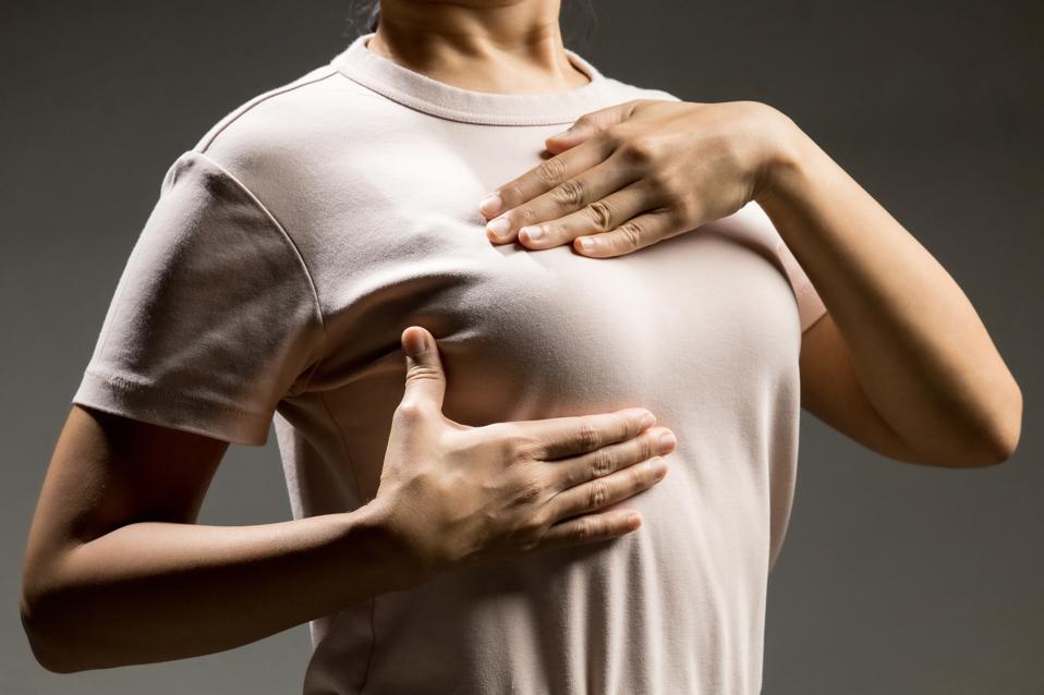 woman does breast self exam