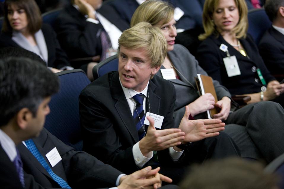 chris hughes, Facebook co-founder, speaking at a conference.