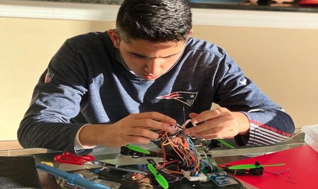 Arya Taschand working on wiring.