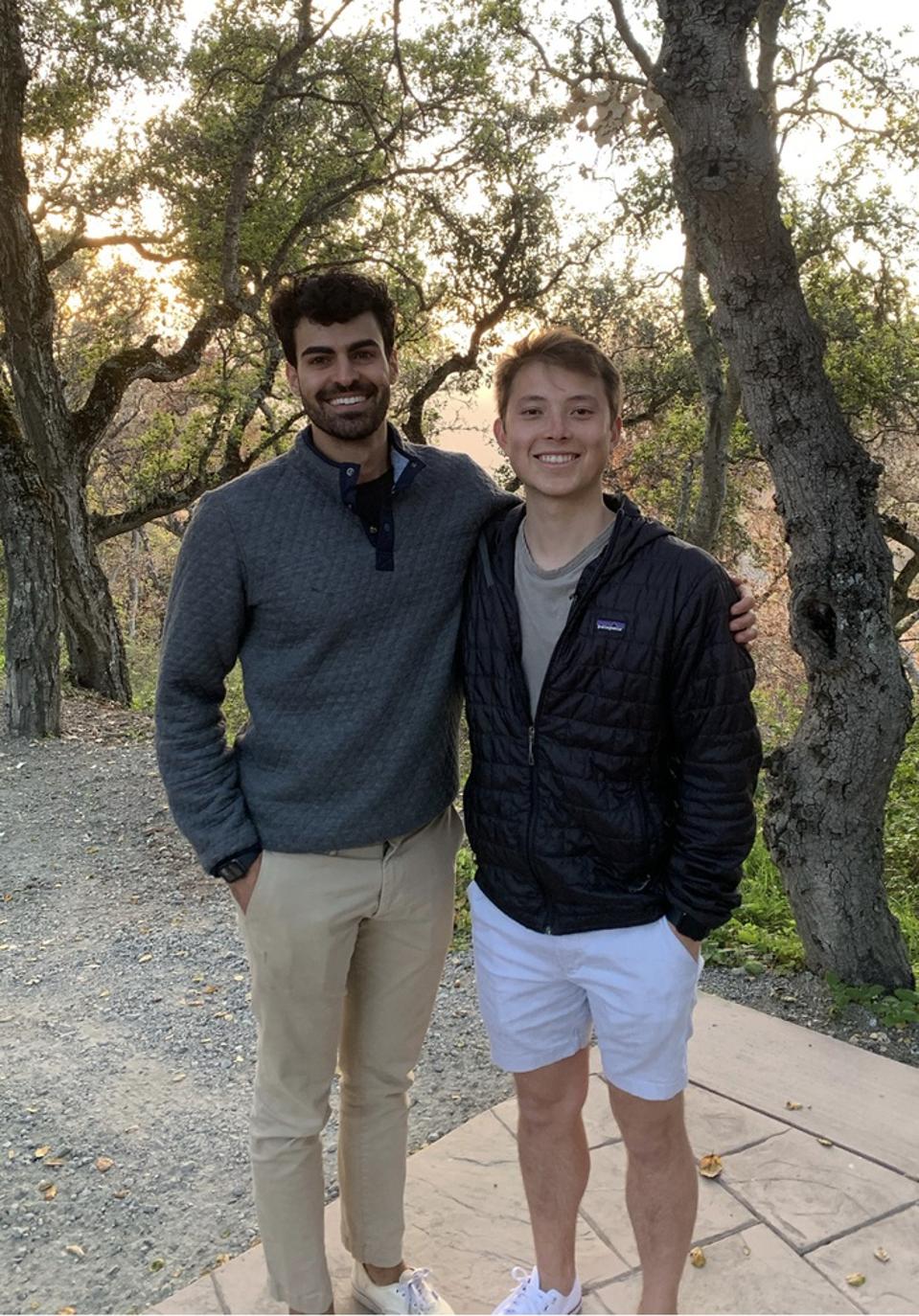 Two guys standing outside.