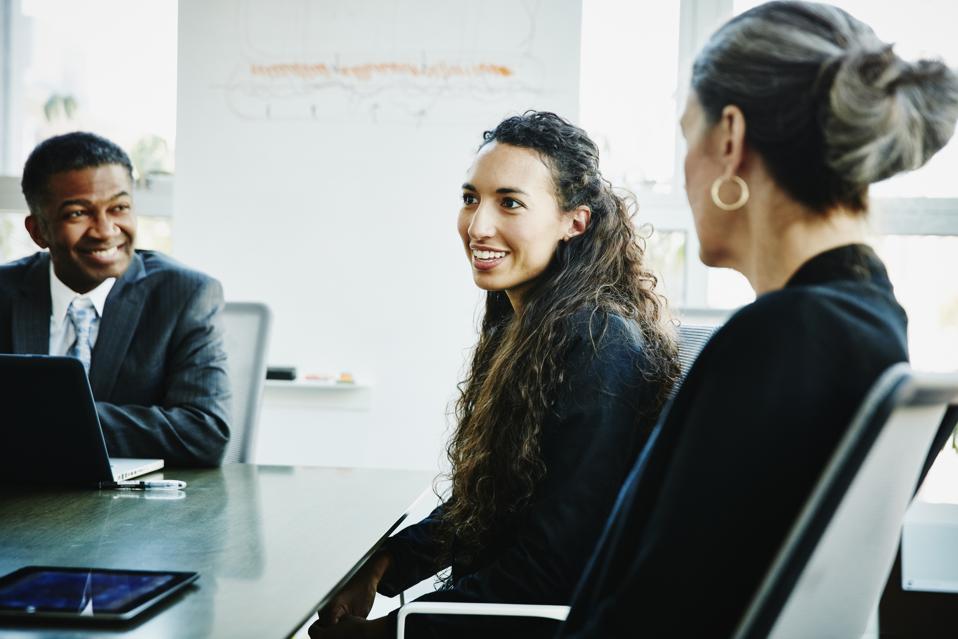 Businesswoman leading discussion during meeting