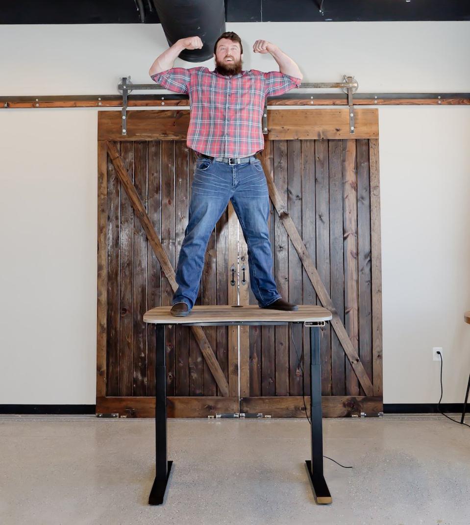 man standing on desk