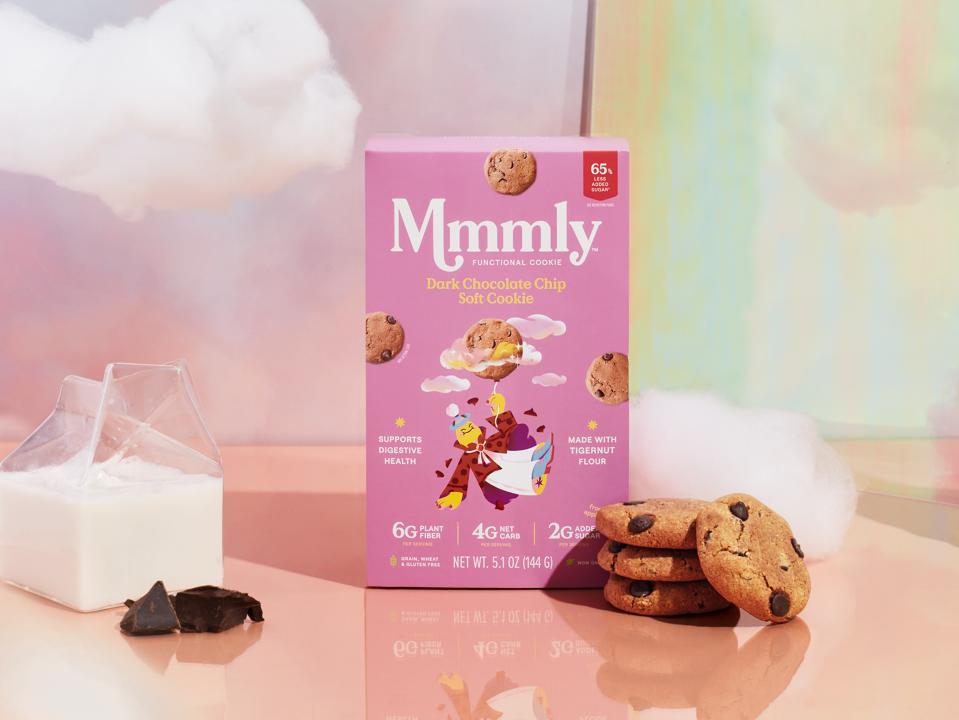 Mmmly dark chocolate chip cookies with a carton of milk.