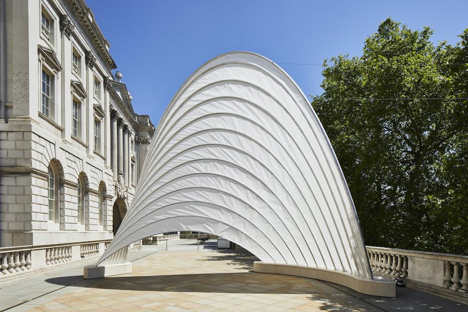 white sail sculpture outdoors
