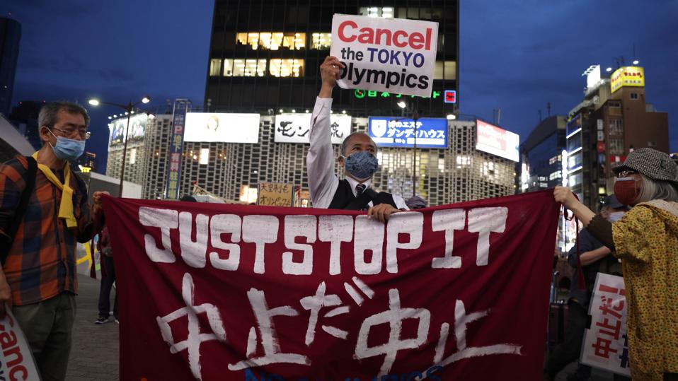 Anti-Tokyo Olympics protesters hold up a banner that reads, ″Just Stop it.″