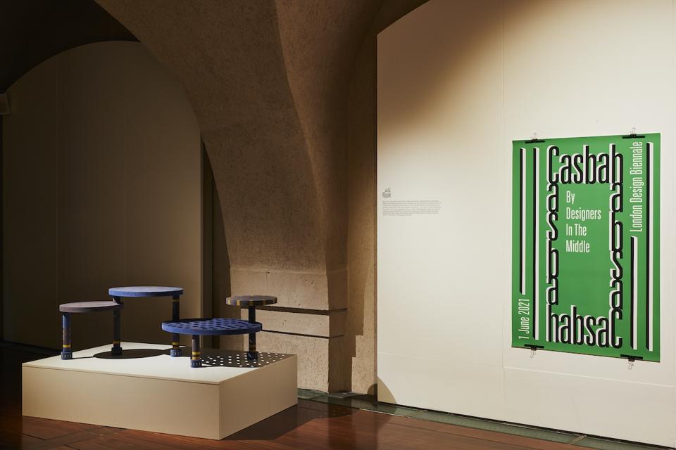 round tables and green poster