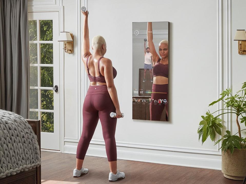 Best deals: Woman working out with Mirror in living room