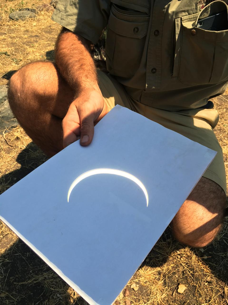 A projected image of a partial eclipse.