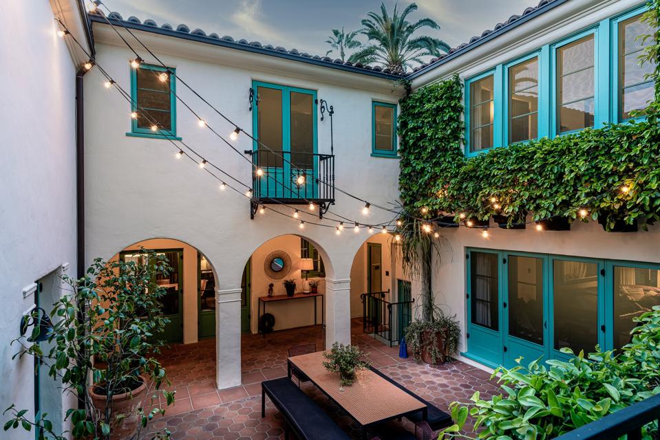 Courtyard with arched doors and strung lights