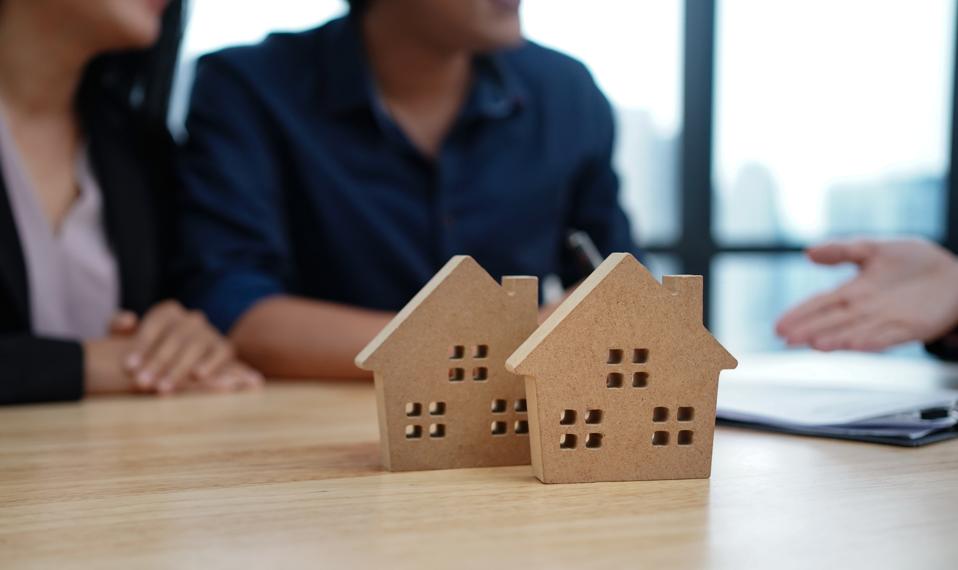 Loan,Contract, Debt and residential investment concept. Contract of loan and estate agreement for investor or buyer to sign for getting approval form the bank.