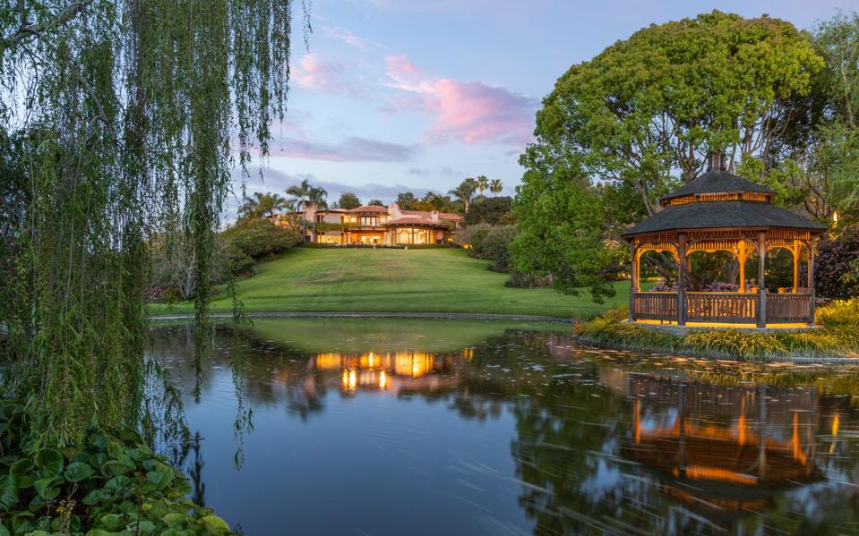 main house at villa nafissa has 16,000 square feet of space and view of lake