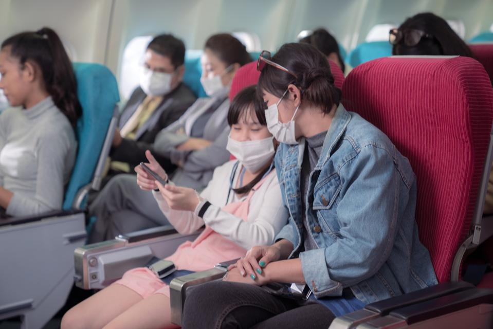 Interior of airplane with passengers on seat. Airplane in flight .