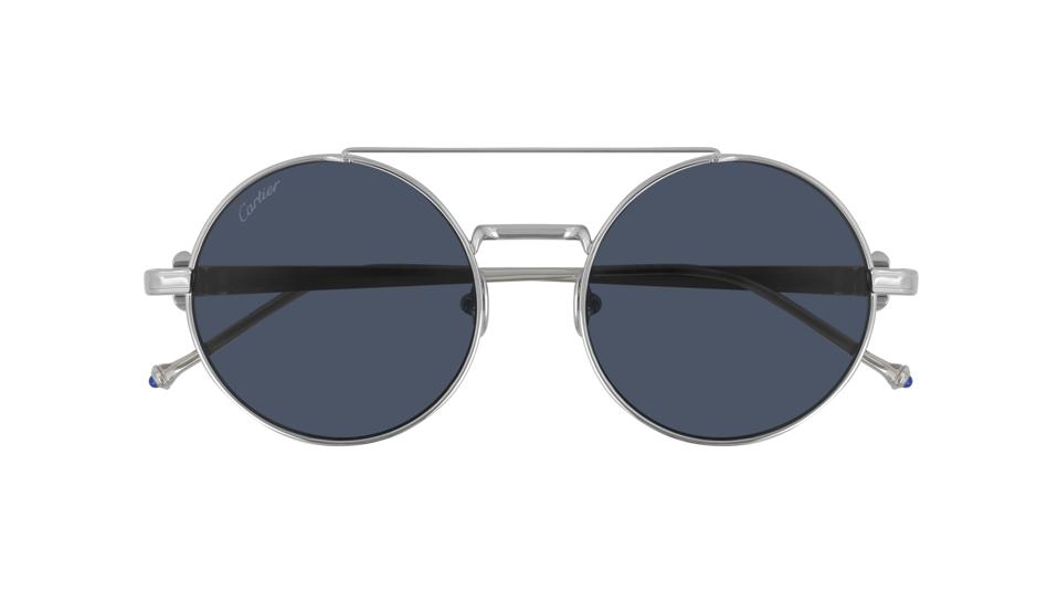 Pasha de Cartier sunglasses in smooth platinum-finish titanium, round shape and blue lenses.