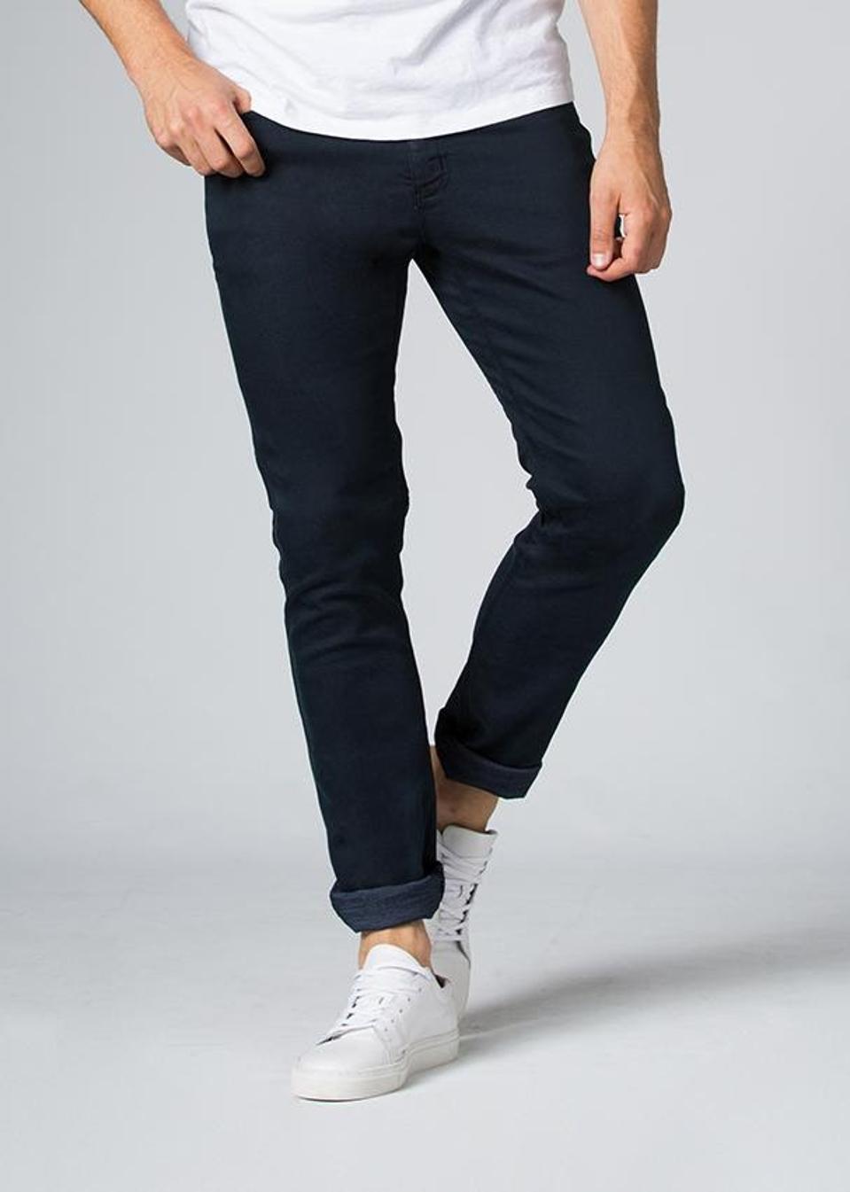 Mid rise with a slim fit through the hip, and slight taper at the hem.